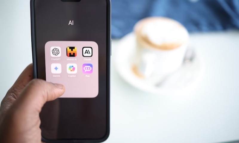 A phone home screen with AI assistant apps